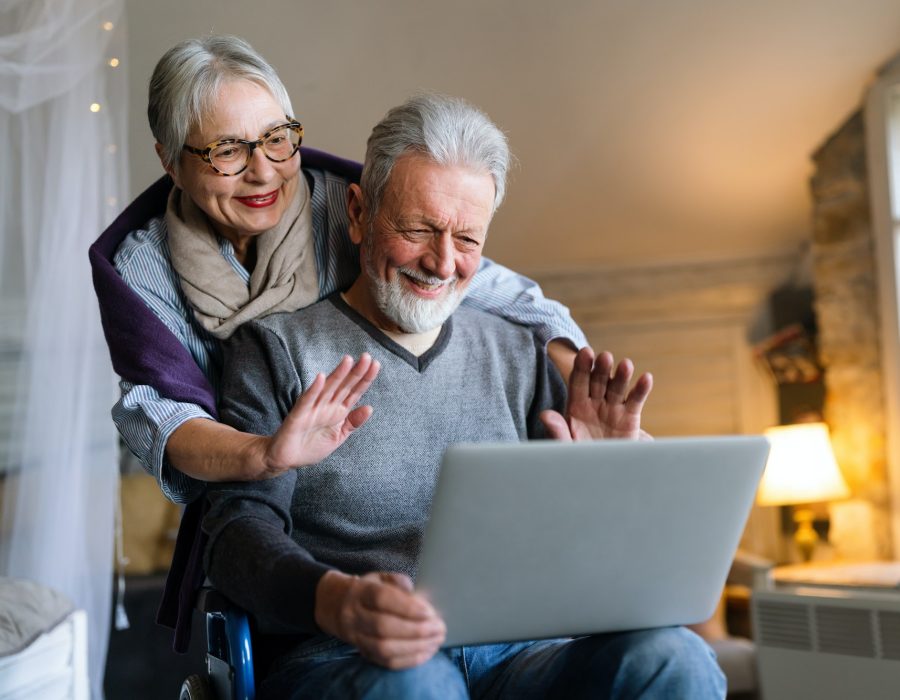 Happy romantic senior couple hugging and enjoying retirement at home